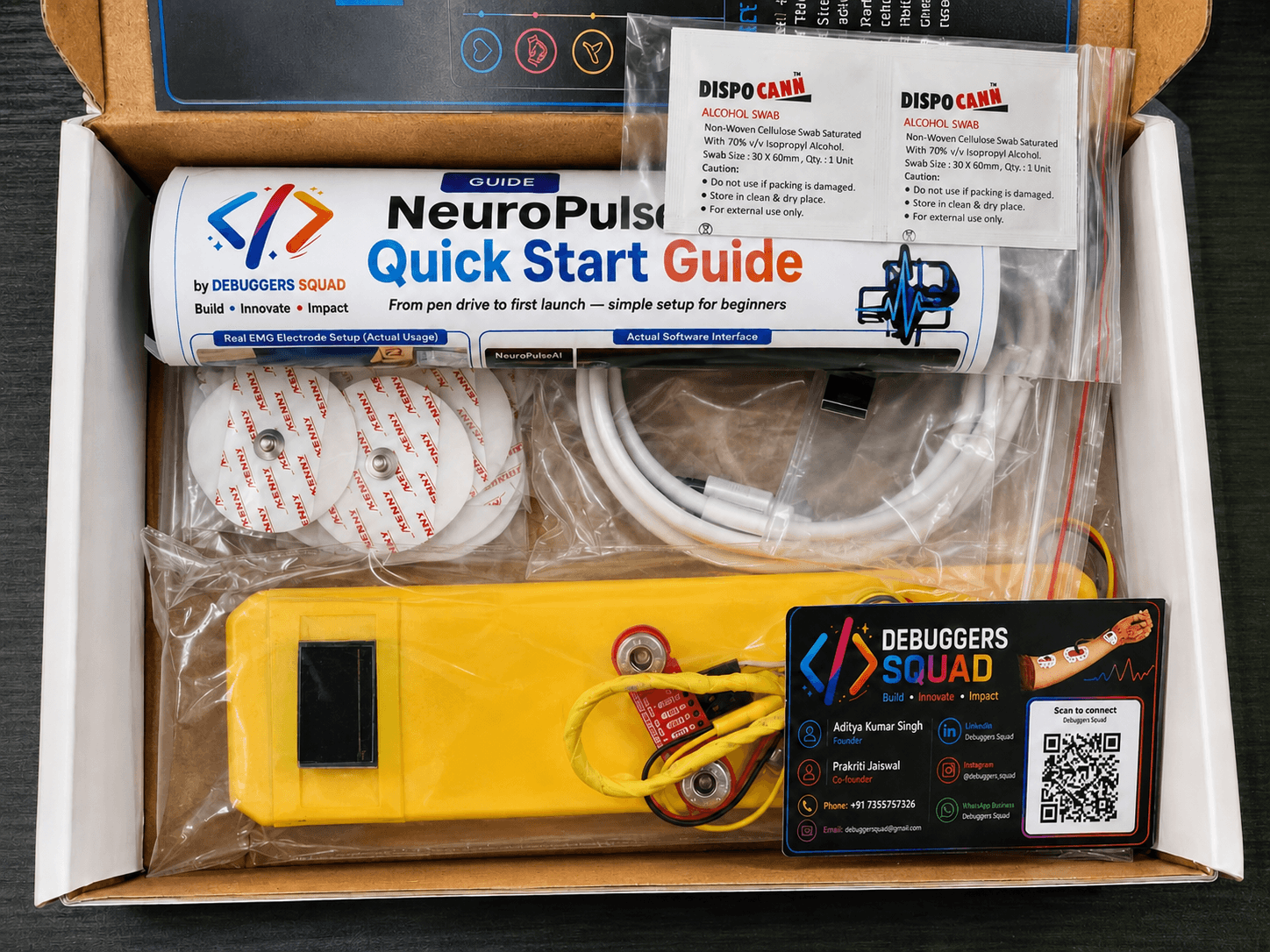 NeuroPulseAI single-channel EMG kit box with device, electrodes, cables, swabs, and quick-start guide