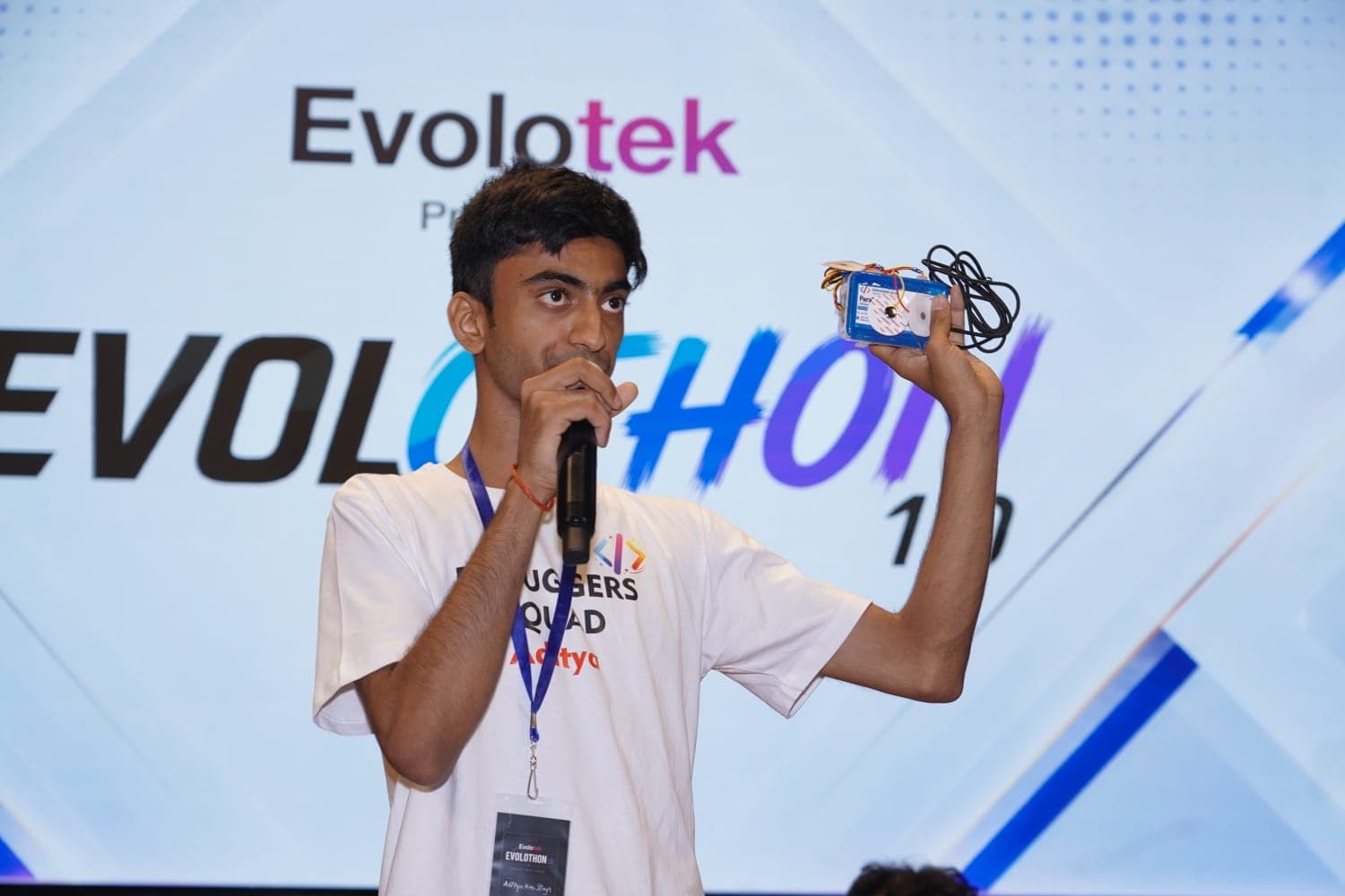 ParaTalk device being shown to an audience during a live demonstration